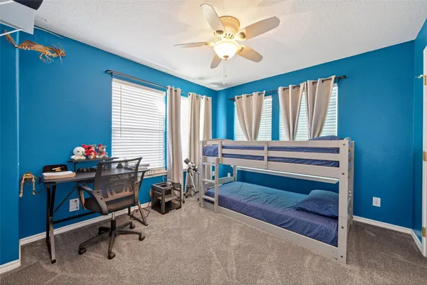 a view of workspace with furniture and a window