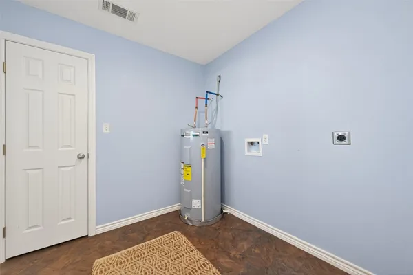 a view of an entryway with wooden floor