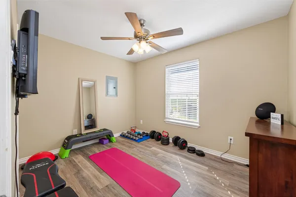 a bedroom with furniture and a window