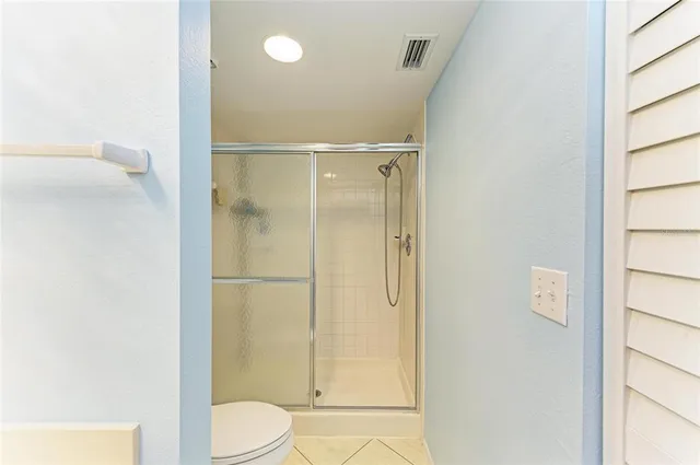 a bathroom with a shower and a toilet