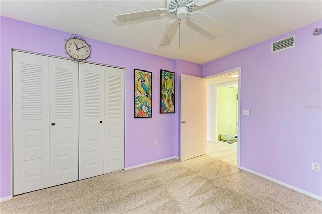 a view of an entryway with a chandelier fan