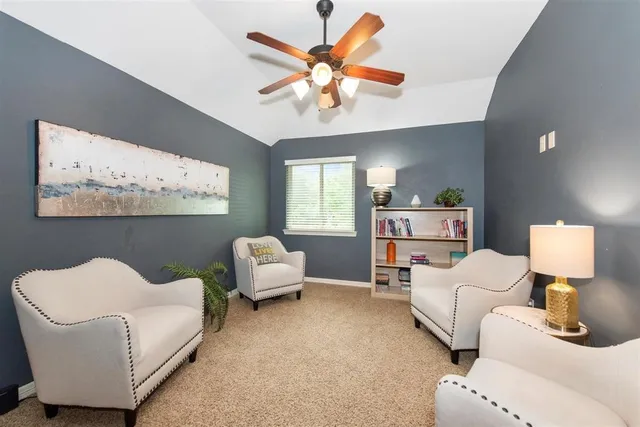 a living room with furniture and window
