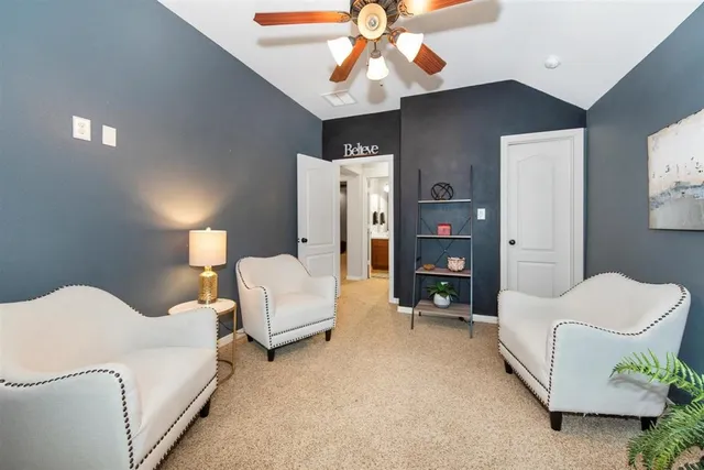 a spacious bedroom with a bed and a walk in closet