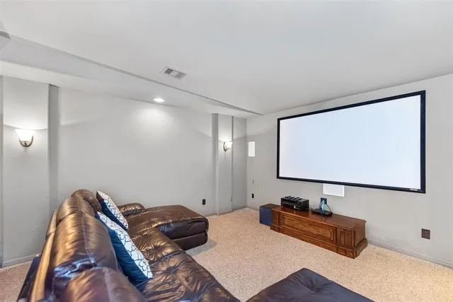 a bedroom with bed and a flat screen tv