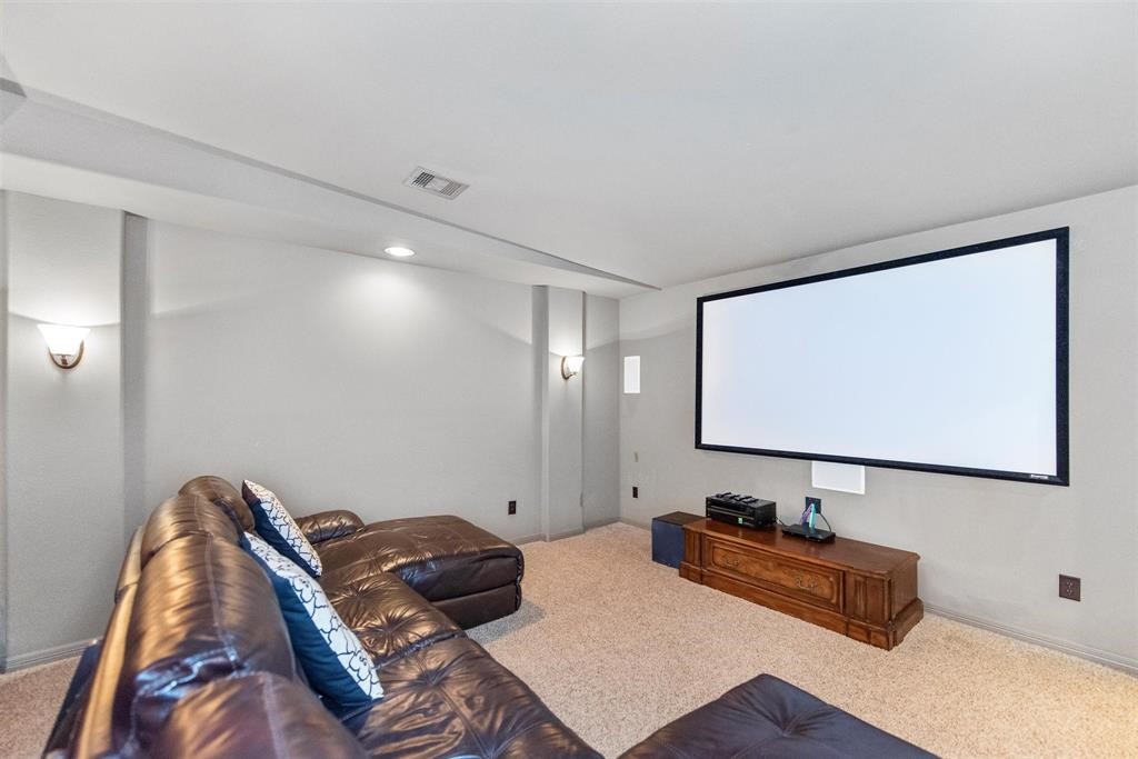 8323 Floating Heart Court Conroe, TX 77385 - Photo 34 of 43 a bedroom with bed and a flat screen tv