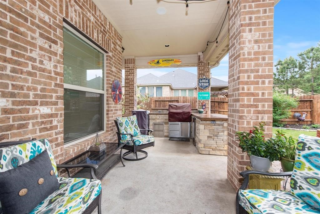8323 Floating Heart Court Conroe, TX 77385 - Photo 38 of 43 a view of an outdoor space with a patio