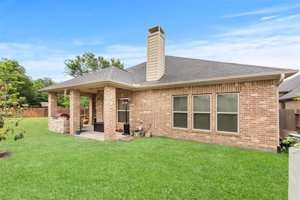8323 Floating Heart Court Conroe, TX 77385 - Photo 42 of 43 front view of a house with a yard