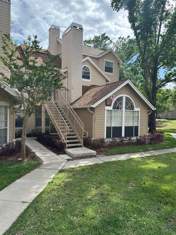 626 Cambridge Way, Unit 98 Altamonte Springs, FL 32714 - Photo 1 of 15 a front view of house with yard and green space