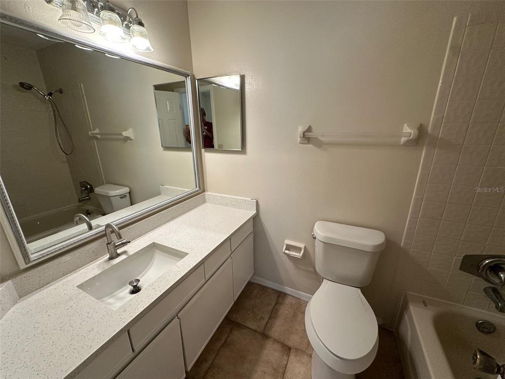 626 Cambridge Way, Unit 98 Altamonte Springs, FL 32714 - Photo 13 of 15 a bathroom with a sink toilet and shower