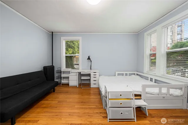 a bedroom with a bed and a window