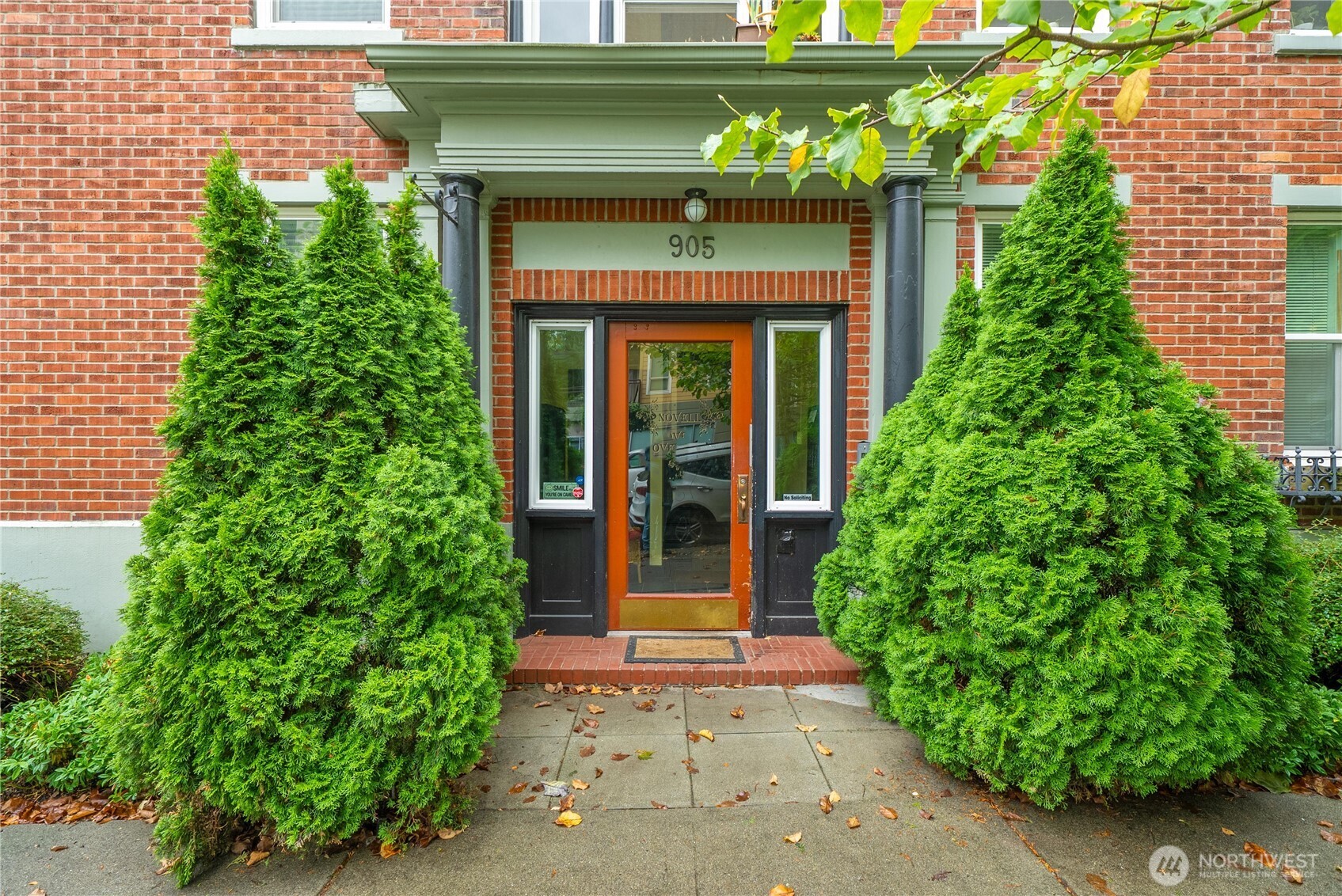 905 Northeast 43rd Street, Unit 107 Seattle, WA 98105 - Photo 3 of 30 a front view of a house with garden