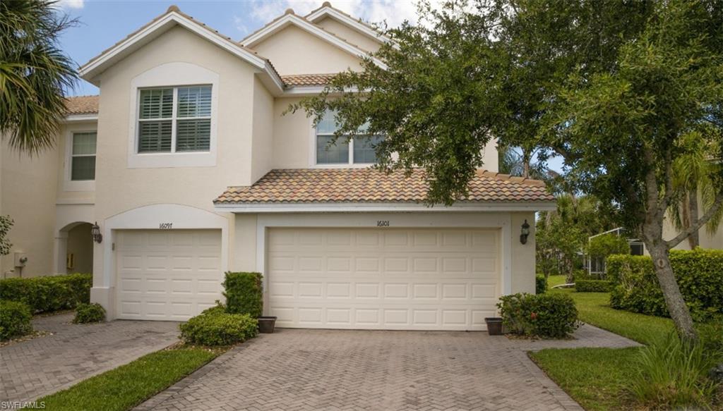 16097 Ravina Way, Unit 36 Naples, FL 34110 - Photo 12 of 19 a front view of a house with garden