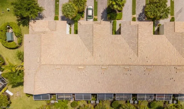 a backyard of a house with lots of green space and fountain