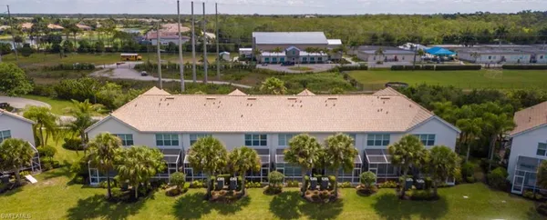 a view of a lake with houses in the back