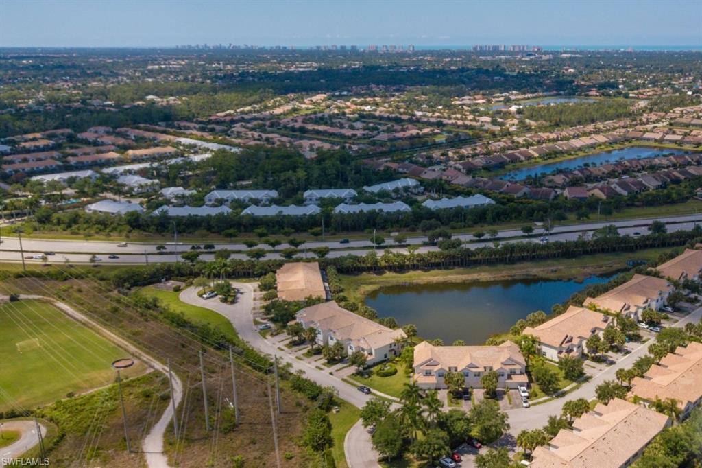 16097 Ravina Way, Unit 36 Naples, FL 34110 - Photo 18 of 19 an aerial view of residential houses with outdoor space and lake view