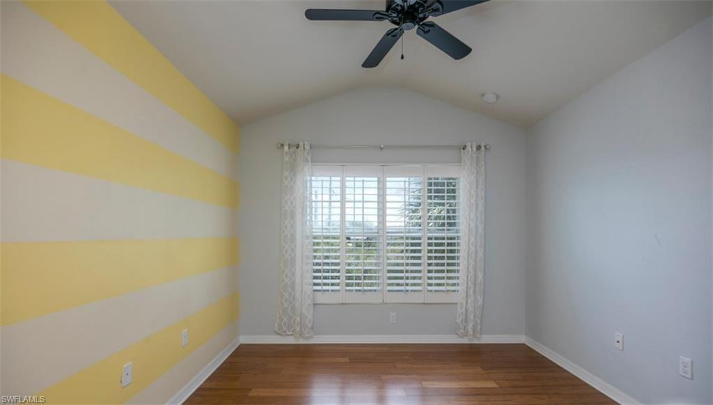 16097 Ravina Way, Unit 36 Naples, FL 34110 - Photo 8 of 19 a view of empty room with wooden floor and fan