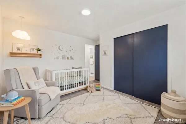 a bedroom with a bed and a table in it