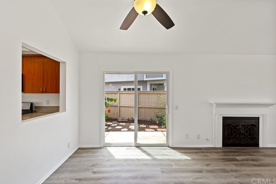 20 Wildwheat Irvine, CA 92614 - Photo 12 of 29 a view of a livingroom with wooden floor and a fireplace