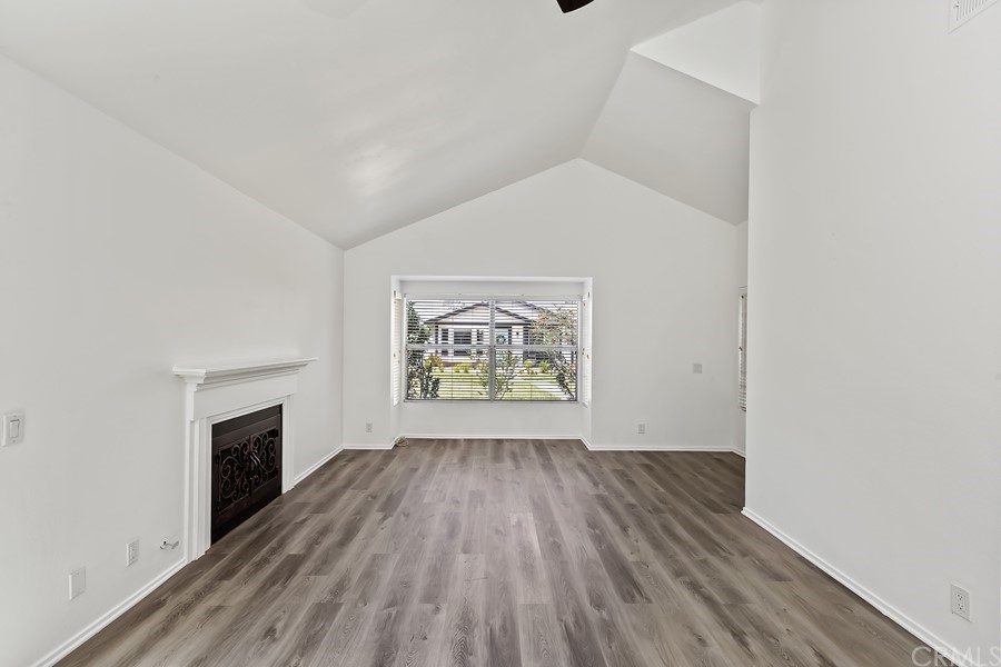 20 Wildwheat Irvine, CA 92614 - Photo 13 of 29 a view of an empty room with wooden floor and a window