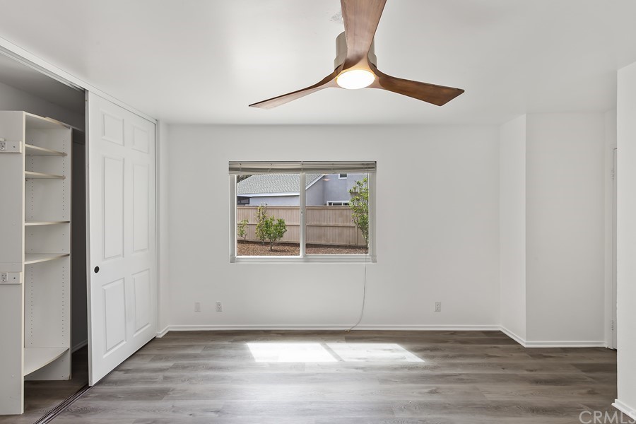 20 Wildwheat Irvine, CA 92614 - Photo 21 of 29 an empty room with wooden floor fan and windows