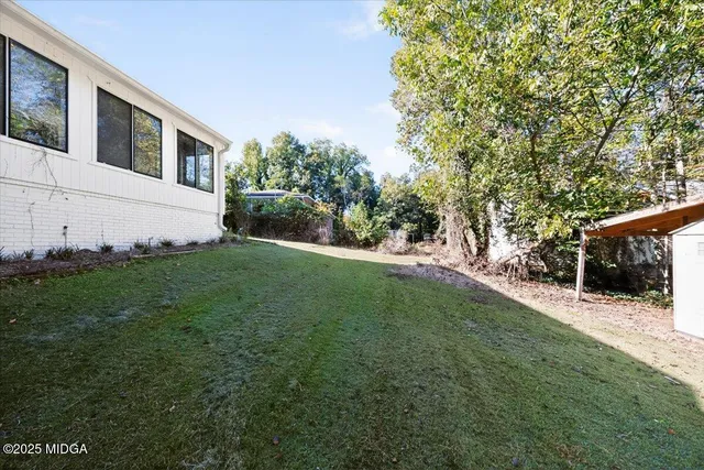 a backyard of a house with lots of green space
