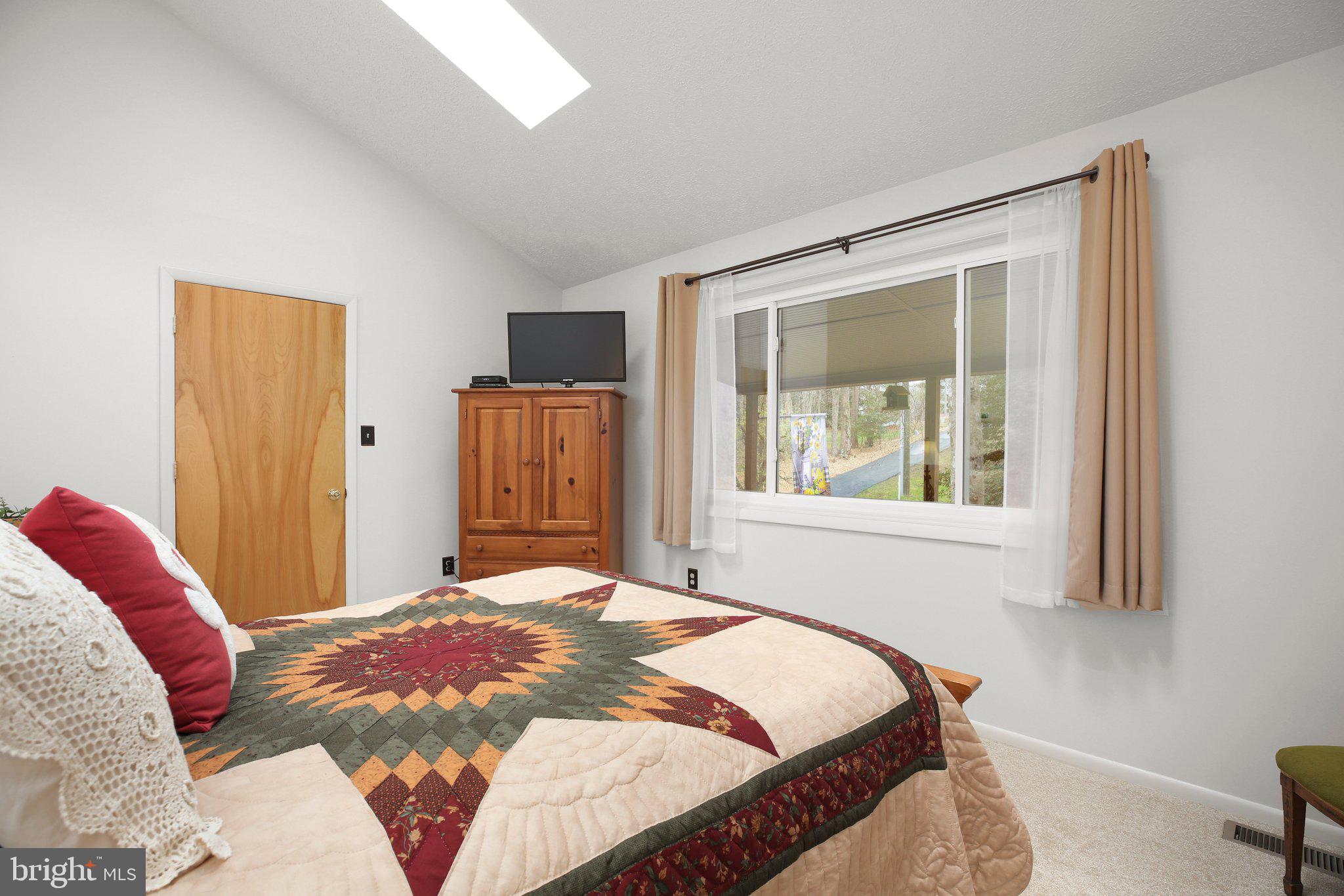 10831 Moore Drive Manassas, VA 20111 - Photo 13 of 52 a bedroom with a bed and a window