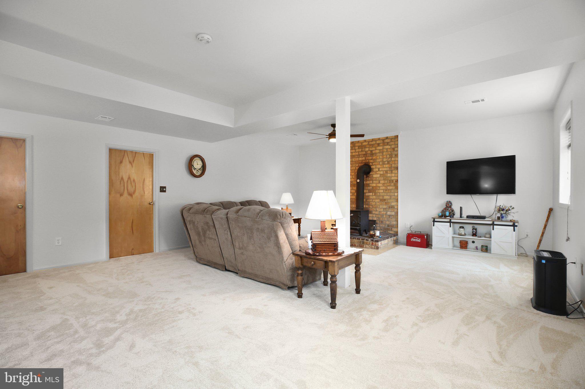 10831 Moore Drive Manassas, VA 20111 - Photo 14 of 52 a living room with furniture and a flat screen tv