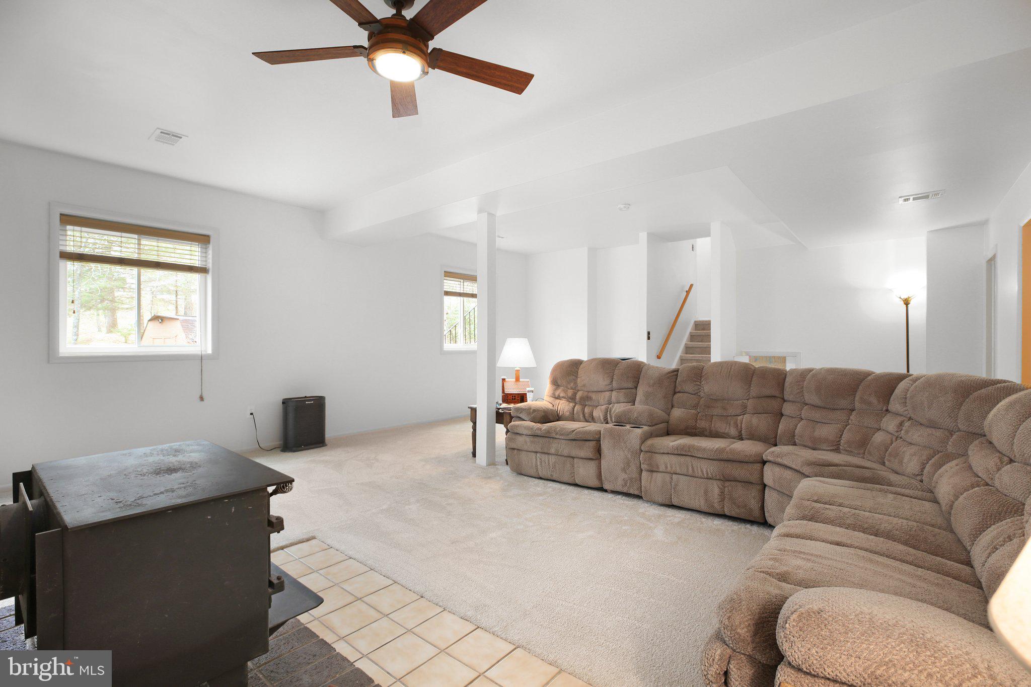 10831 Moore Drive Manassas, VA 20111 - Photo 17 of 52 a living room with furniture and a window
