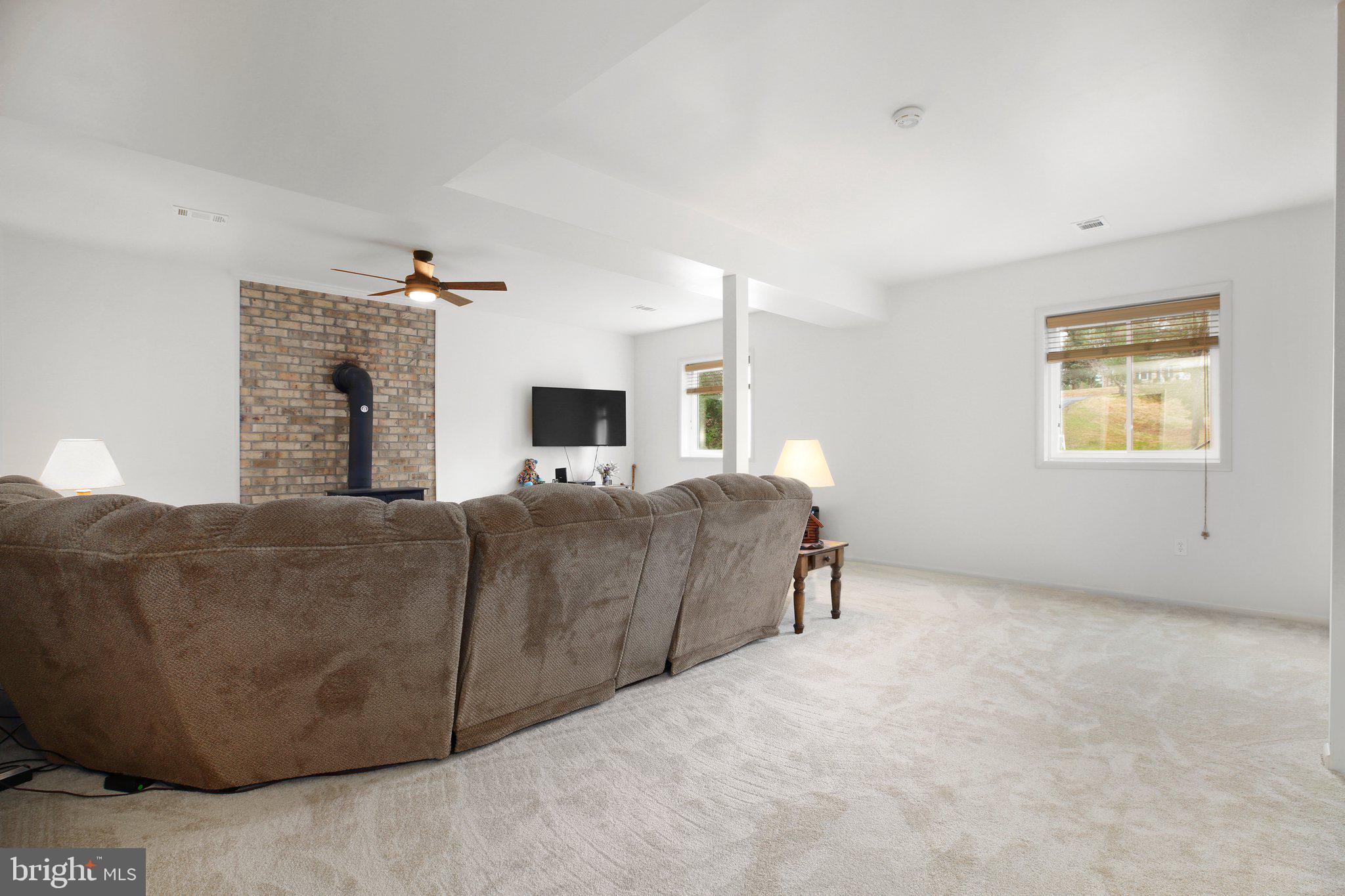 10831 Moore Drive Manassas, VA 20111 - Photo 18 of 52 a living room with furniture and a fireplace