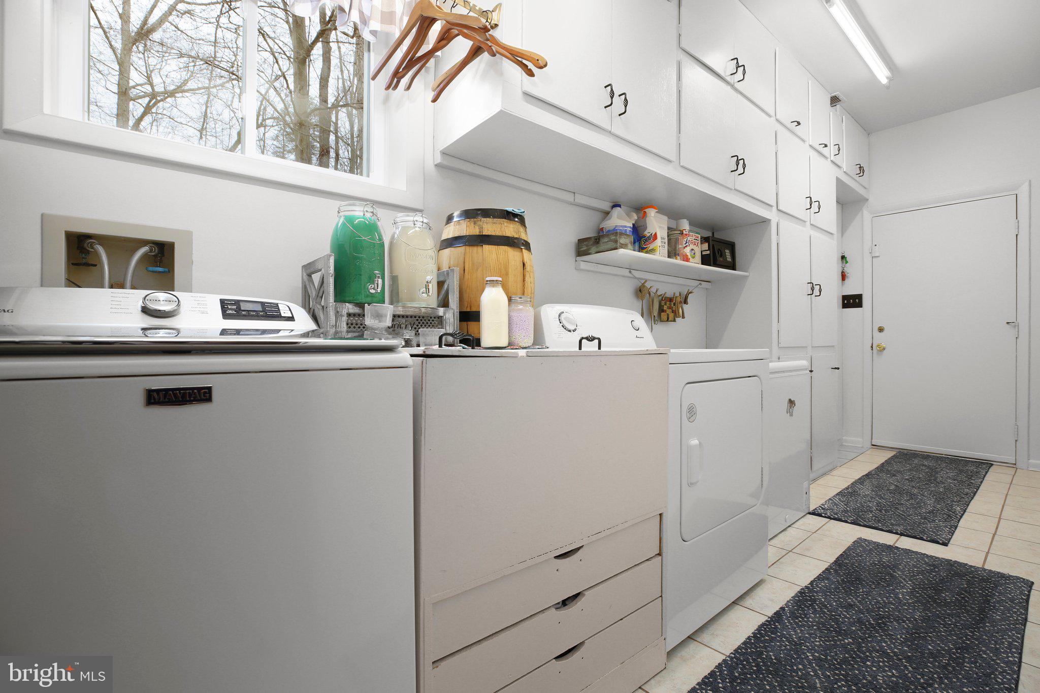 10831 Moore Drive Manassas, VA 20111 - Photo 19 of 52 a kitchen with stainless steel appliances granite countertop a sink and cabinets