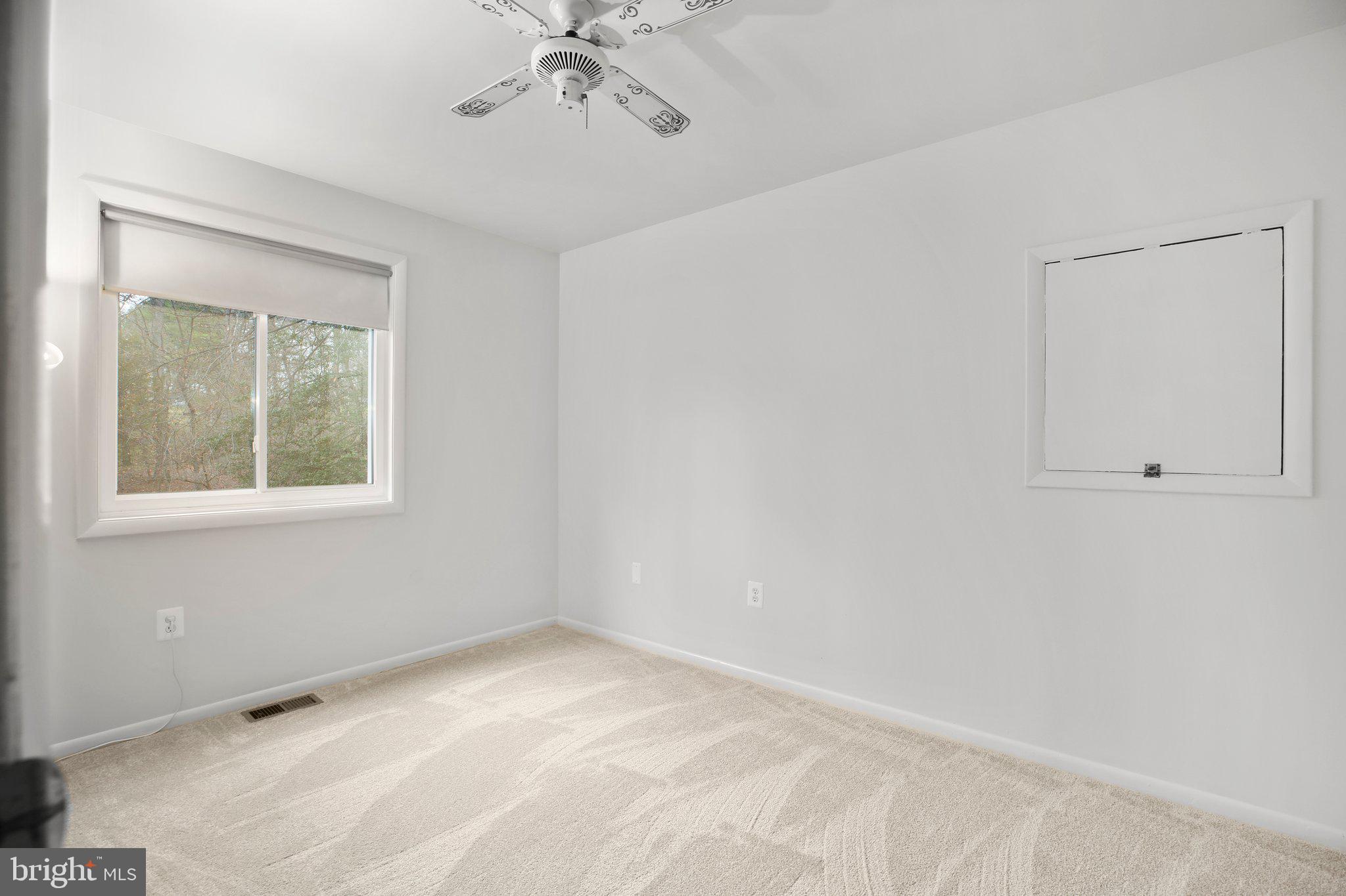 10831 Moore Drive Manassas, VA 20111 - Photo 22 of 52 a view of an empty room with a window
