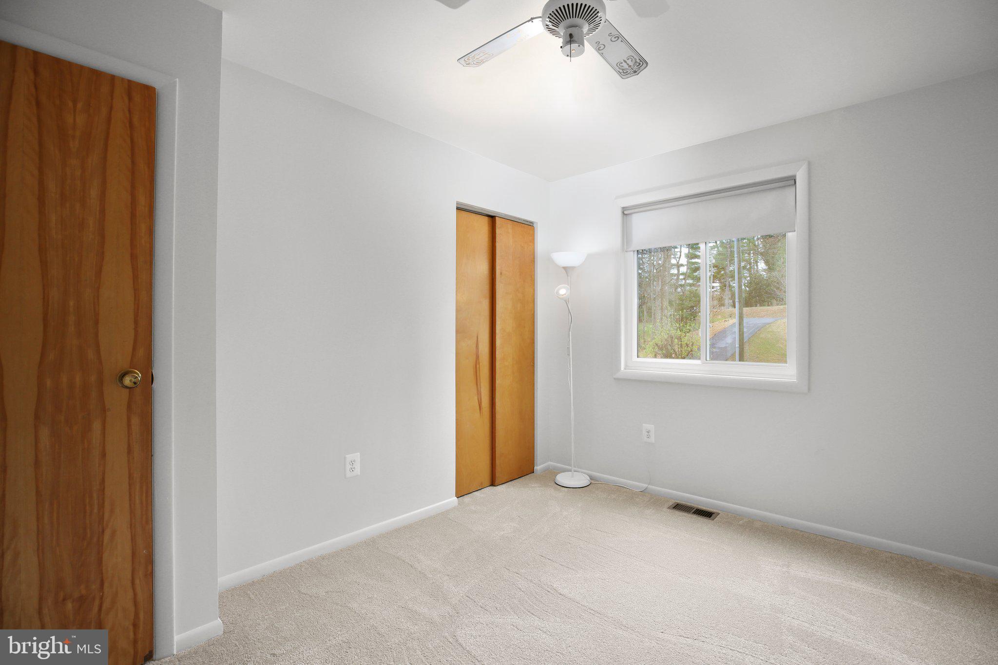 10831 Moore Drive Manassas, VA 20111 - Photo 23 of 52 an empty room with windows and closet