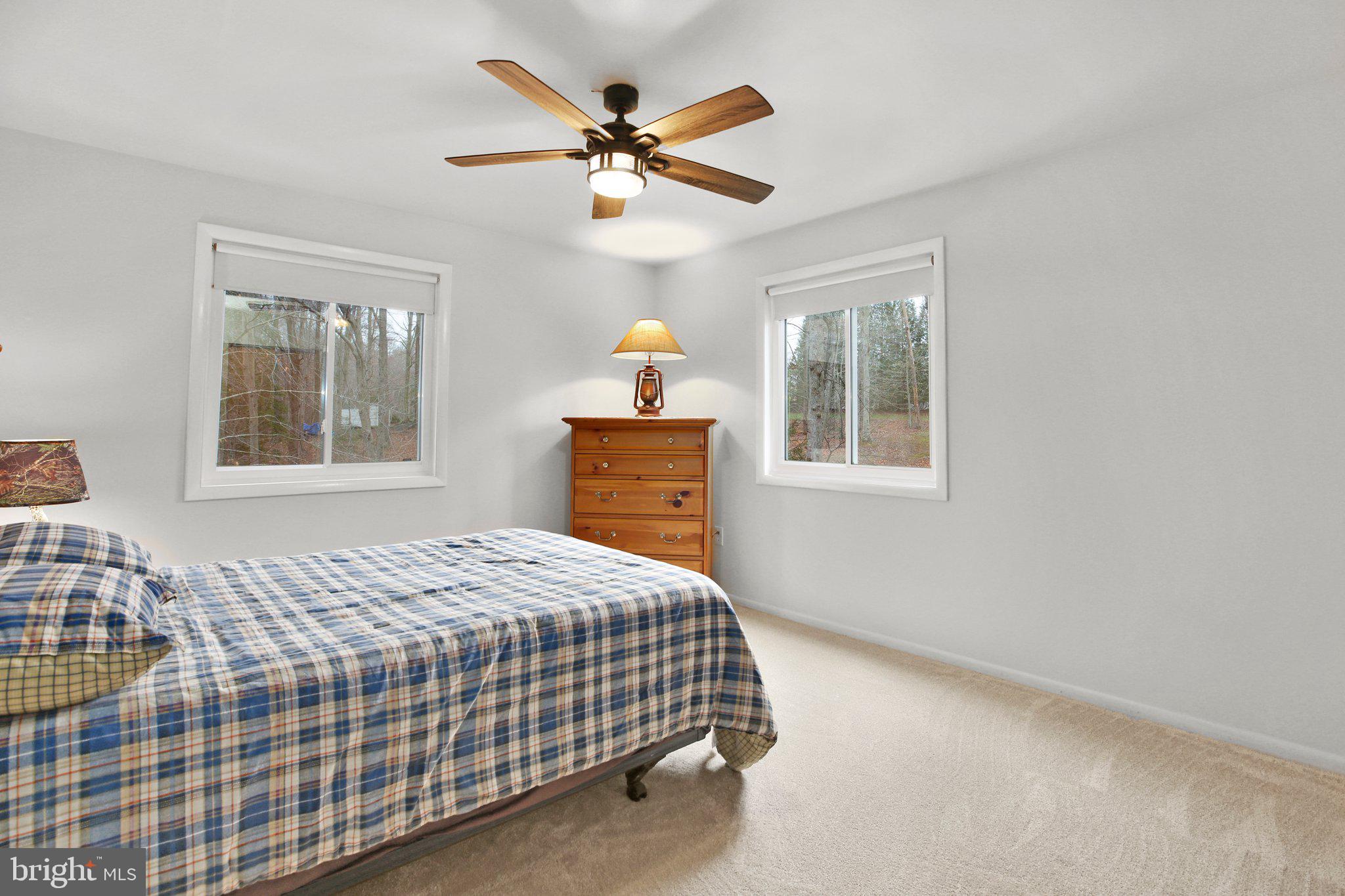 10831 Moore Drive Manassas, VA 20111 - Photo 25 of 52 a bedroom with a bed and a window