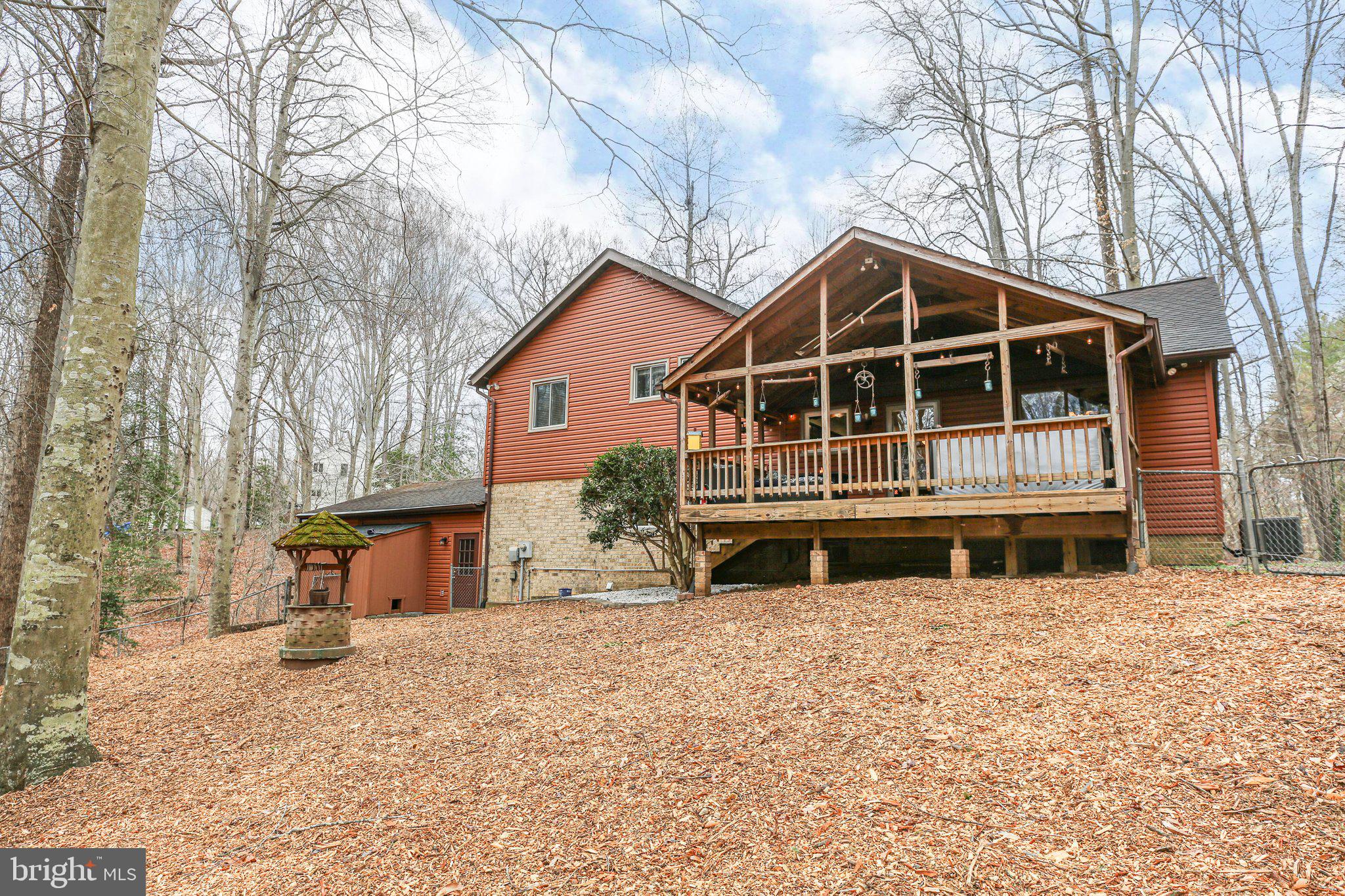 10831 Moore Drive Manassas, VA 20111 - Photo 43 of 52 a front view of a house with a yard