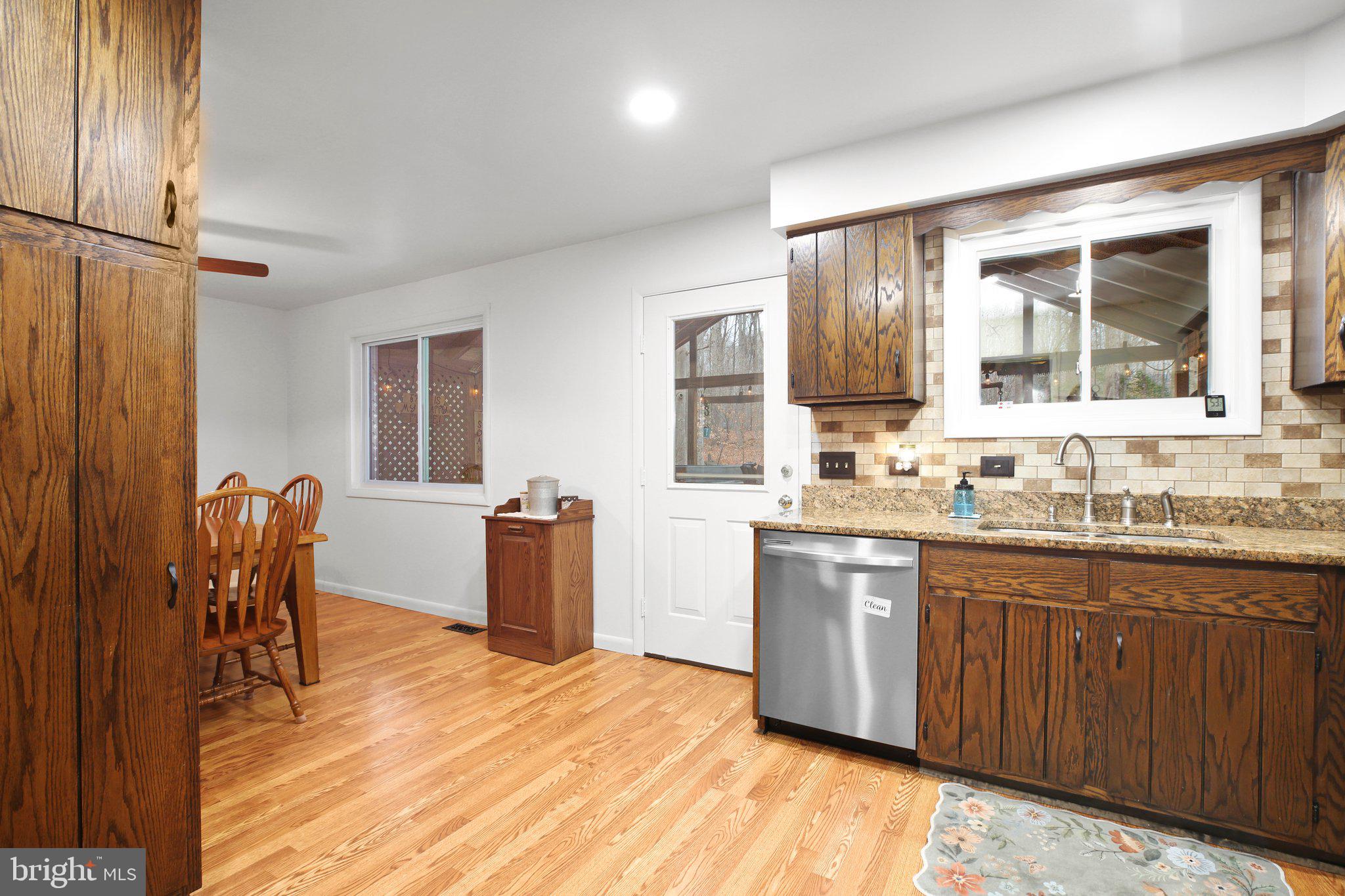 10831 Moore Drive Manassas, VA 20111 - Photo 9 of 52 a large kitchen with kitchen island a sink stainless steel appliances and cabinets
