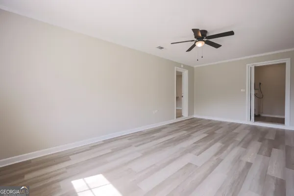 a view of a hallway with a wooden floor