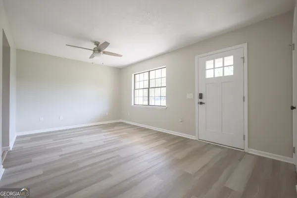 a kitchen with a sink stove and microwave