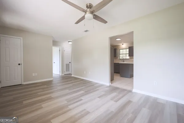 a kitchen with a sink stove and microwave
