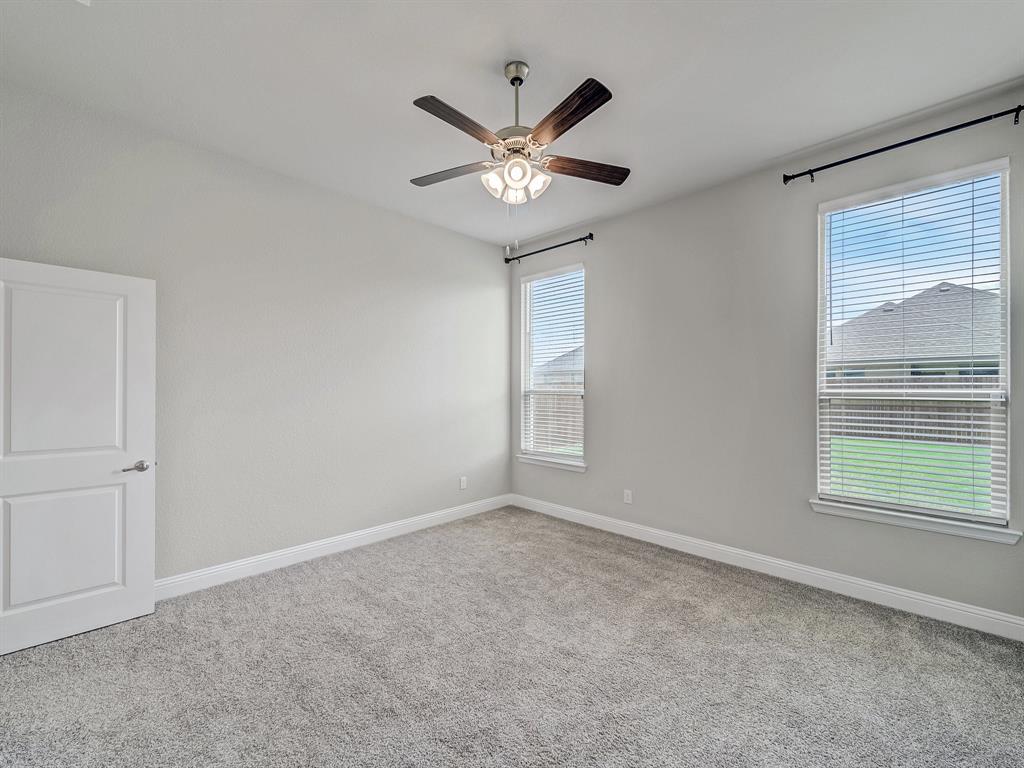 3443 April Breeze Trail Grand Prairie, TX 76065 - Photo 12 of 29 a view of an empty room with a window