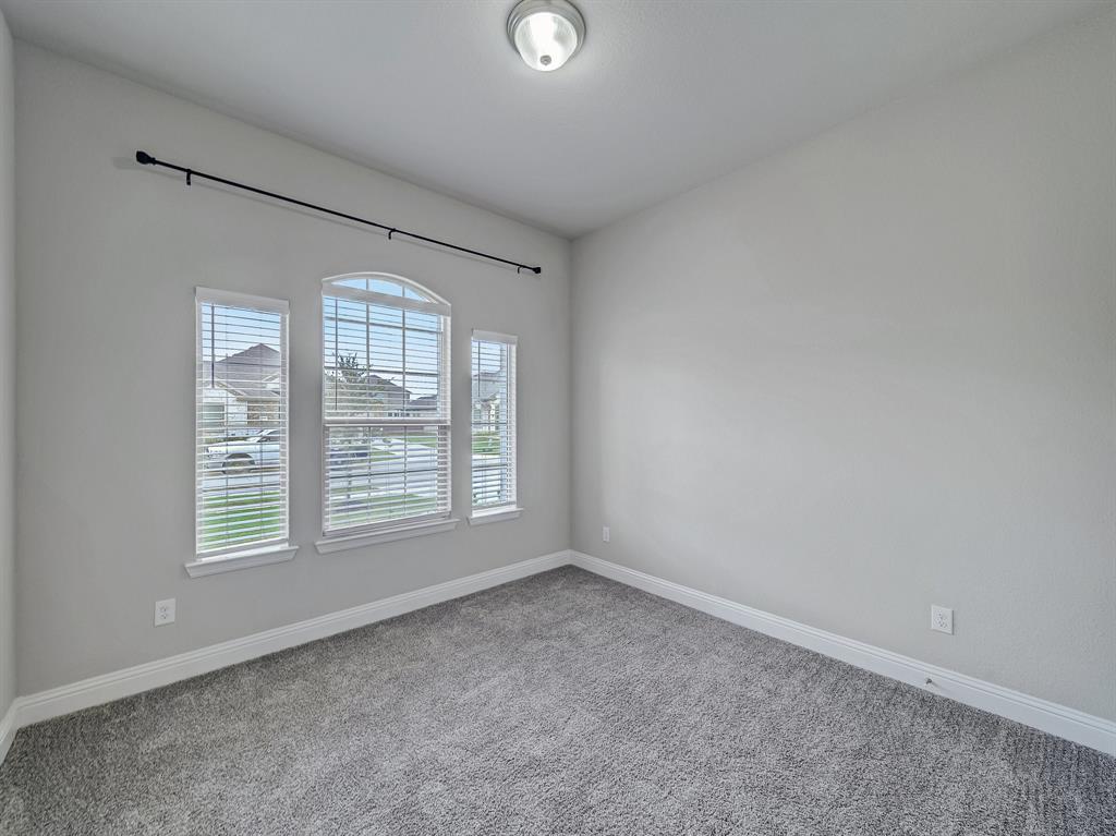 3443 April Breeze Trail Grand Prairie, TX 76065 - Photo 18 of 29 an empty room with a window