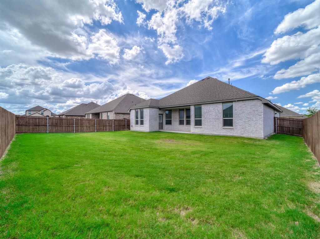 3443 April Breeze Trail Grand Prairie, TX 76065 - Photo 24 of 29 a view of a house with a big yard