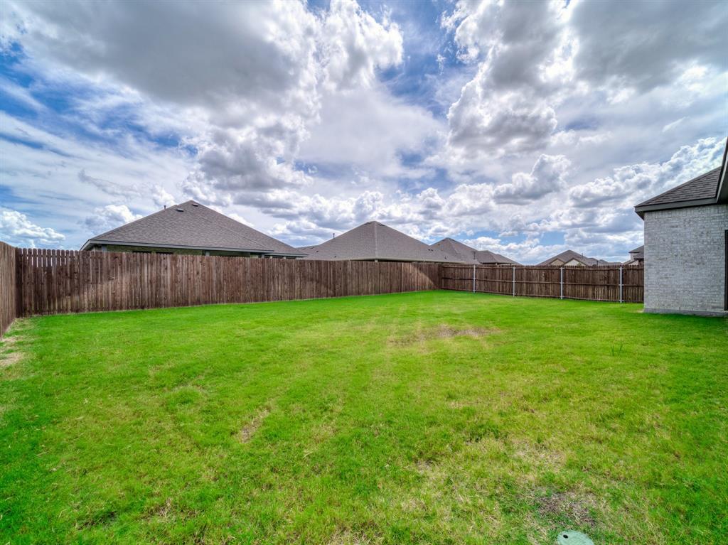 3443 April Breeze Trail Grand Prairie, TX 76065 - Photo 25 of 29 a view of house with backyard