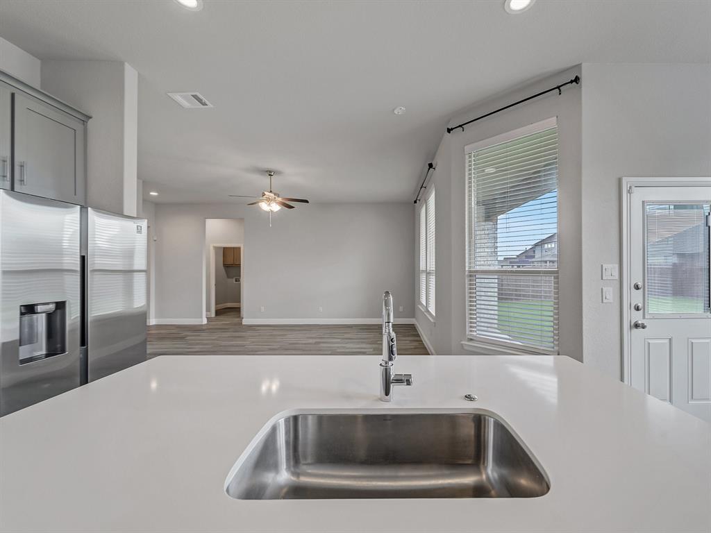 3443 April Breeze Trail Grand Prairie, TX 76065 - Photo 9 of 29 a bathroom with a sink a large mirror and a bathtub