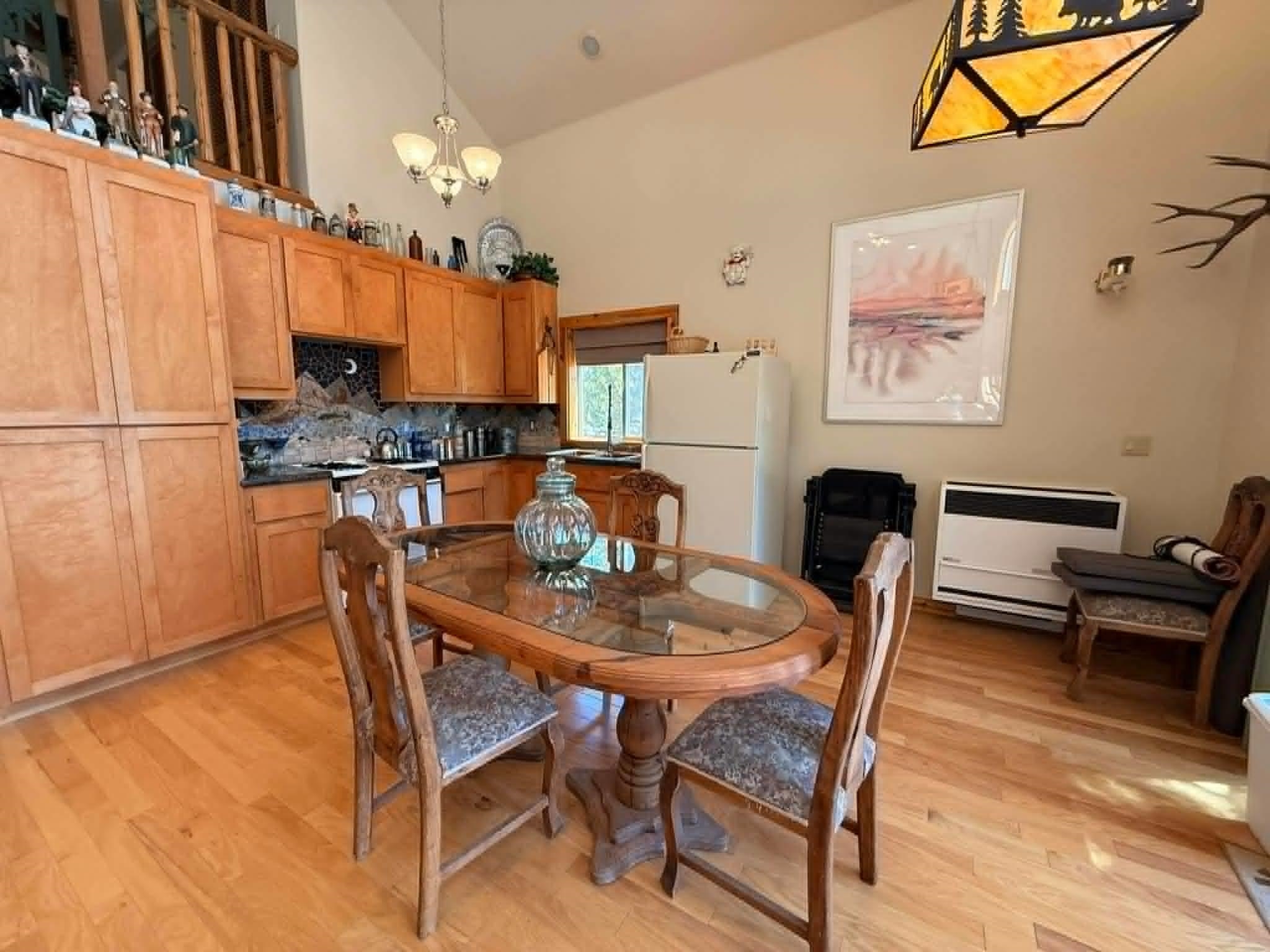 93 Juniper Road Beckwourth, CA 96129 - Photo 8 of 35 a view of a dining room with furniture and a chandelier