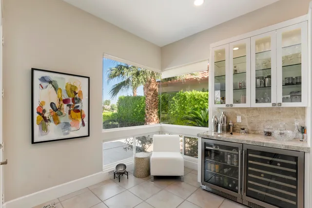 a bathroom with a tub a sink and a window