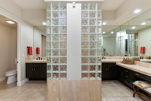 a spacious bathroom with a bathtub sink and mirror