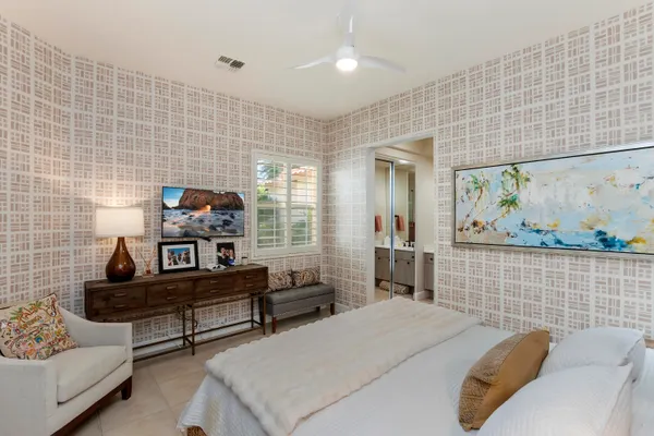 a bedroom with furniture and a window