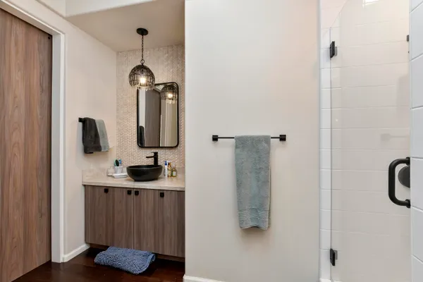 a bathroom with a sink and a mirror