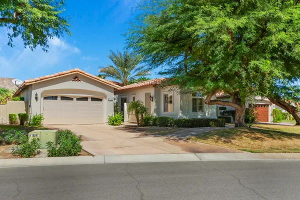front view of a house with a small yard