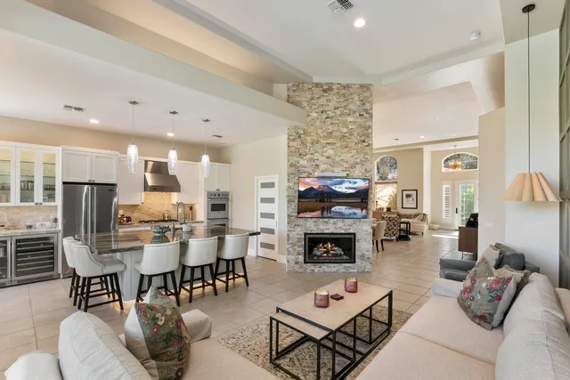a living room with fireplace furniture and a fireplace